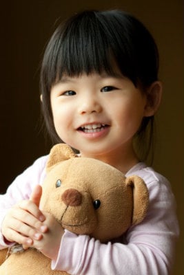 smiling girl teddy bear