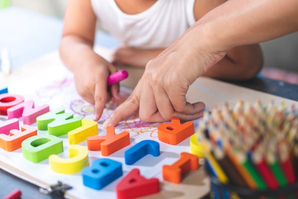 A Mom exploring fun ways to teach the alphabet to her little girl.