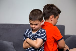 Angry kid offended not talking ignoring brother after fight, jealous kid brother avoiding preschool boy , siblings bad relationships, two children conflict