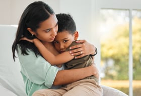 a young mother helping her child who is anxious and scare.