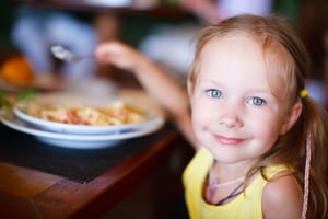 adorable little girl having lunch at a restaurant in North Olmsted.