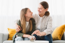 A mother teachers her teenage daughter how important it is to save money.