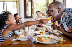 a father and daughter enjoy eating at a Lorain, Ohio restaurant.