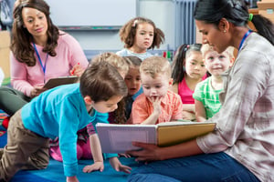 Children learning how to read in a preschool class.