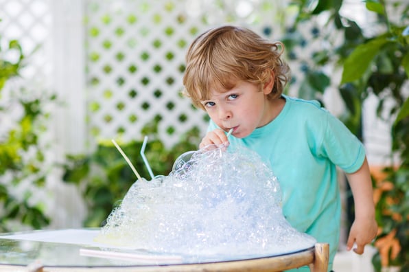 toddler doing a science experiment